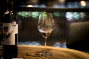 Glasses of Red Wine on a Cozy Evening Table Glasses of Red Wine on a Cozy Evening Table
